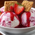 Strawberry Cheesecake Ice Cream Homemade strawberry cheesecake ice cream with strawberries and graham crackers, no-churn, creamy and fruity dessert in a white bowl