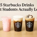 Five Starbucks drinks lined up on a light wooden table, including Iced Matcha Latte, Pink Drink, Vanilla Sweet Cream Cold Brew, Iced Mocha with whipped cream, and Strawberry Açaí Refresher, with the title "5 Starbucks Drinks That Students Actually Love" above them.