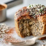 Bariatric seed mug cake sliced open with visible chia and flaxseeds
