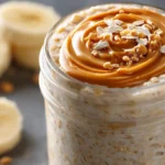 Overnight oats recipe with peanut butter and banana in a glass jar