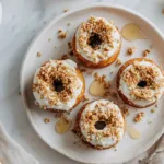 Caramelized donut peaches on a white plate with honey and yogurt — easy summer dessert for students.