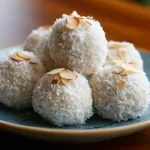 No-Bake Coconut Cream Balls on a white plate with shredded coconut and a coffee cup beside — quick 5-minute dessert for students