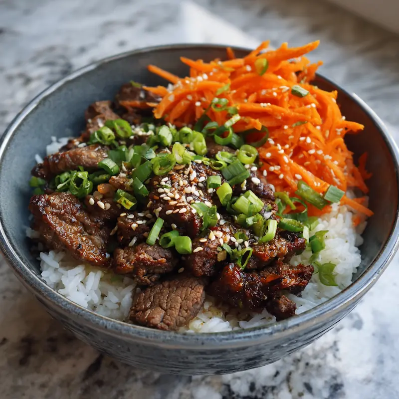 ✨ Easy Korean Ground Beef Bowl — Cheap, Quick & Addictive (Student Edition) 5 Beef dinner bowl topped with scallions, sesame, and quick pickled carrots.