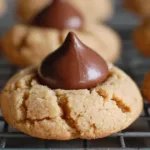 Soft and chewy Hershey Kiss cookies made with classic peanut butter dough cooling on a wire rack