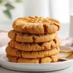 Easy & Chewy Peanut Butter Cookies (Classic & Soft) Stack of easy and chewy peanut butter cookies with classic fork crisscross tops, soft centers, and golden edges