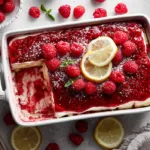 Easy raspberry tiramisu with lady finger desserts topped with a glossy raspberry layer