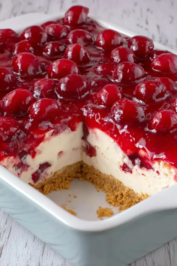 Cherry Delight Dessert — The Creamy, No-Bake Classic Everyone Loves 2 Close-up of a no-bake cherry delight dessert with graham cracker crust, creamy cheesecake filling, and glossy cherry topping.