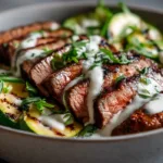 Grilled Marinated Steak: The Juiciest High-Protein Dinner You’ll Ever Make grilled marinated steak bowl with grilled zucchini and creamy sauce, healthy high-protein dinner