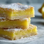 Easy Lemon Bars Recipe With Lemon Juice (Better Than Pioneer Woman Lemon Bars?) Stacked lemon bars recipe with lemon juice, buttery shortbread crust and bright yellow filling dusted with powdered sugar
