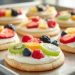 Fruit Pizza Cookies (Easy, Colorful & Crowd-Pleasing) Fruit pizza cookies topped with cream cheese frosting and fresh strawberries, blueberries, and kiwi on soft sugar cookies
