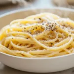 Microwave pasta for one plated in a white bowl in a bright modern American kitchen with a clean minimal look.